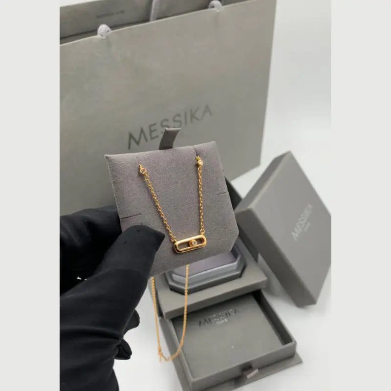 Messika gold necklace, single plain ring