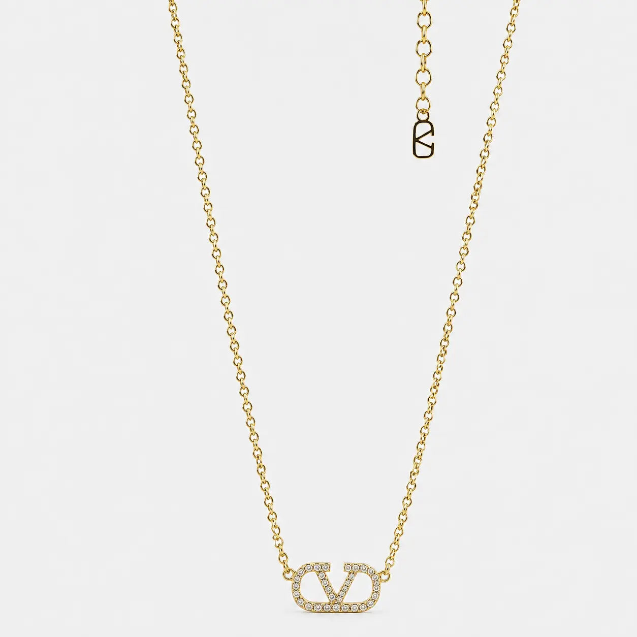 Gold إكس براندات necklace with crystals