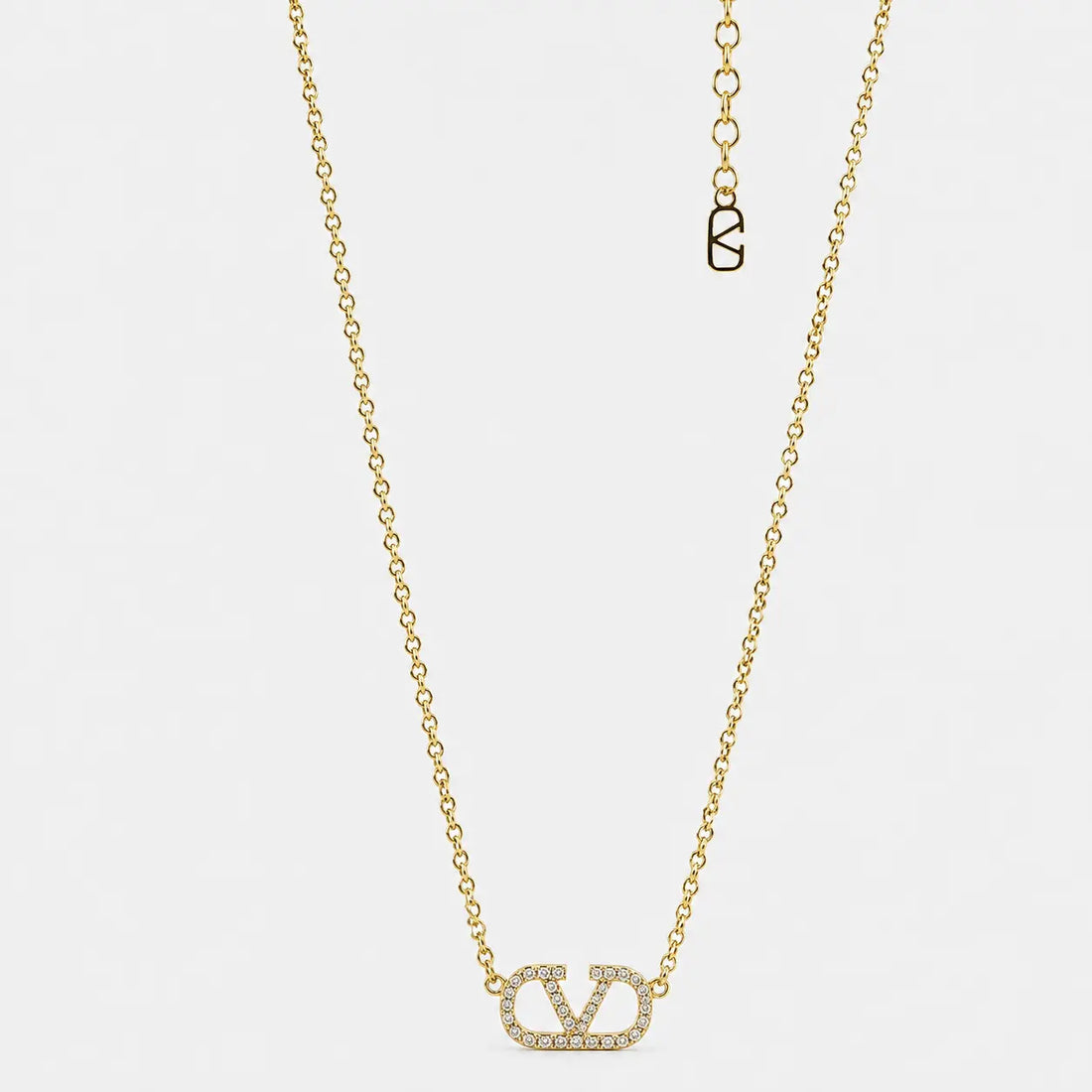 Gold إكس براندات necklace with crystals
